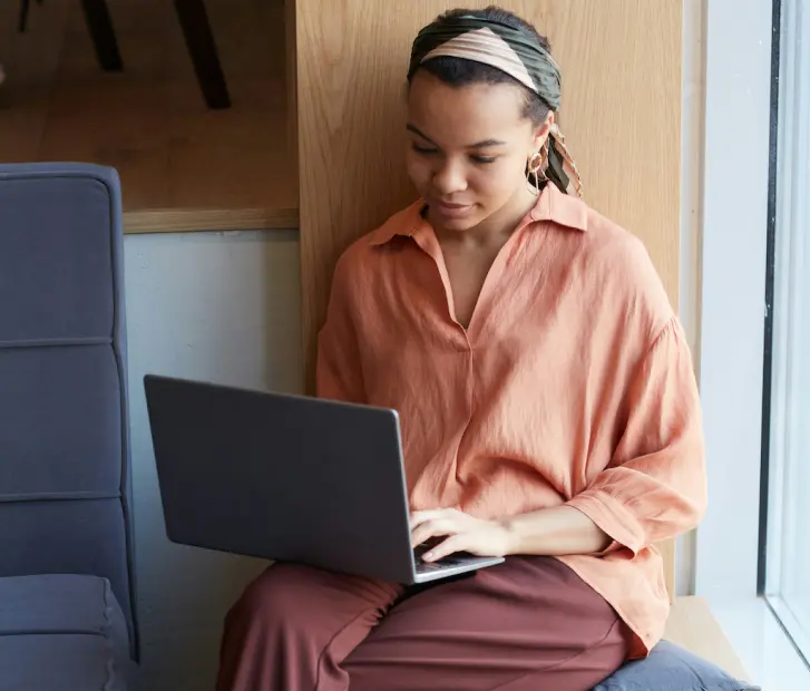 Young Woman Working on Laptop